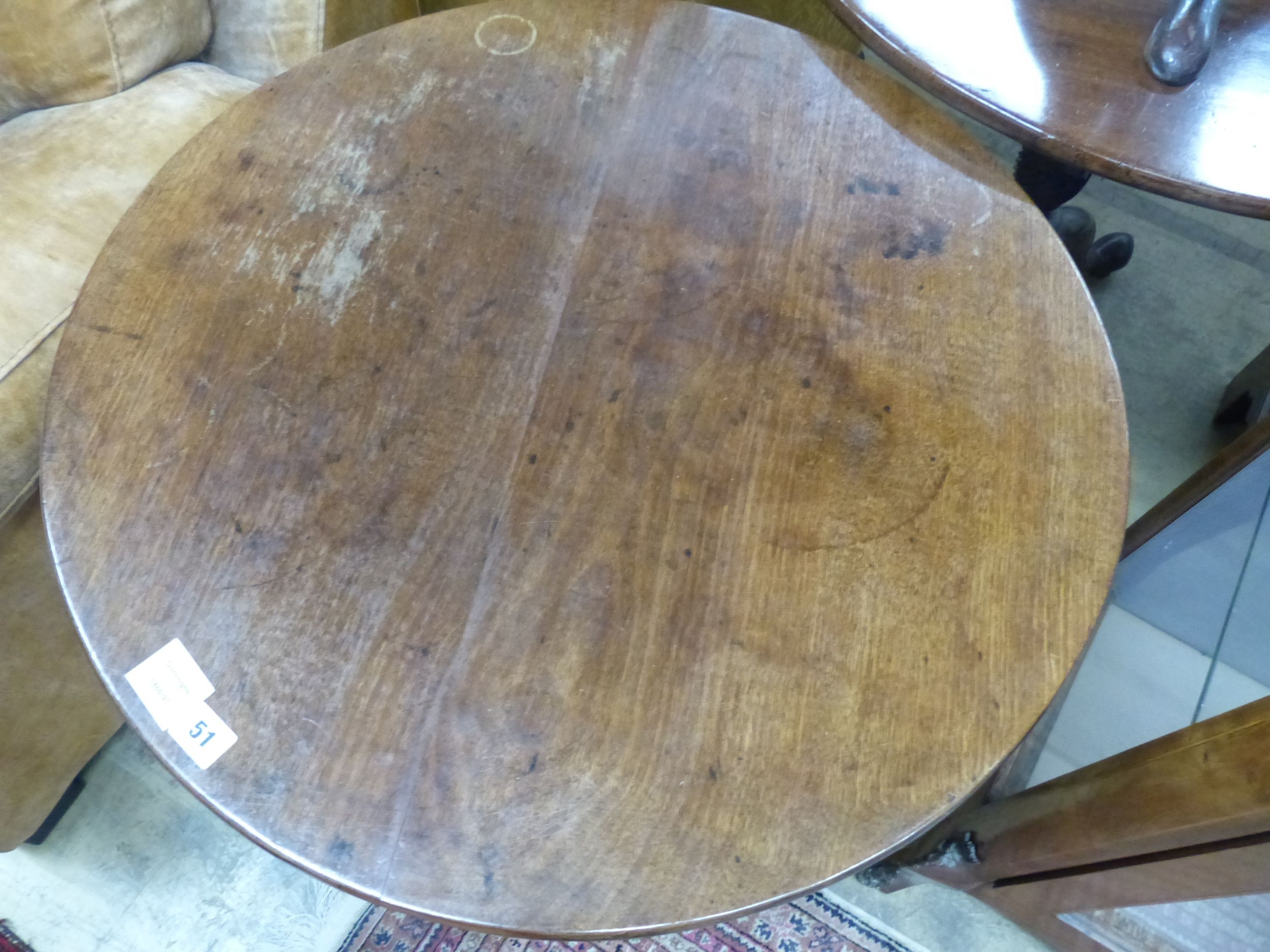 A George III circular mahogany tilt top tripod tea table, Diam.71cm H.70cm